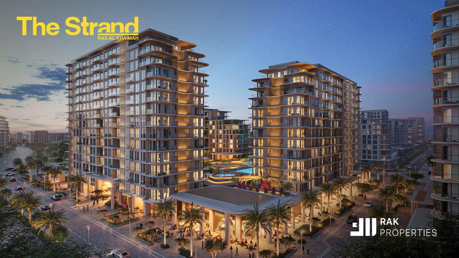 The Strand van RAK Properties, projectimpressie van gebouwen en terrassen in avondlicht